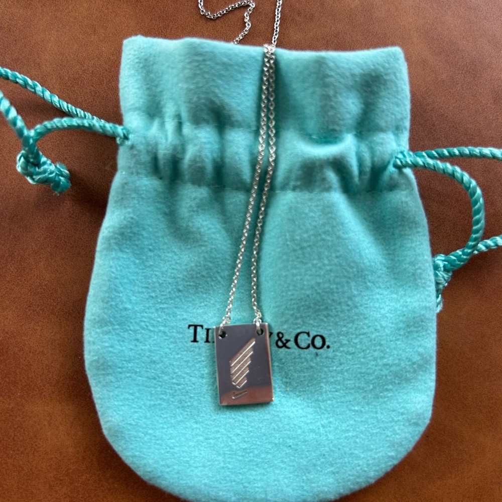 Original Tiffany & Co. Sterling silver Nike SF half marathon necklace.